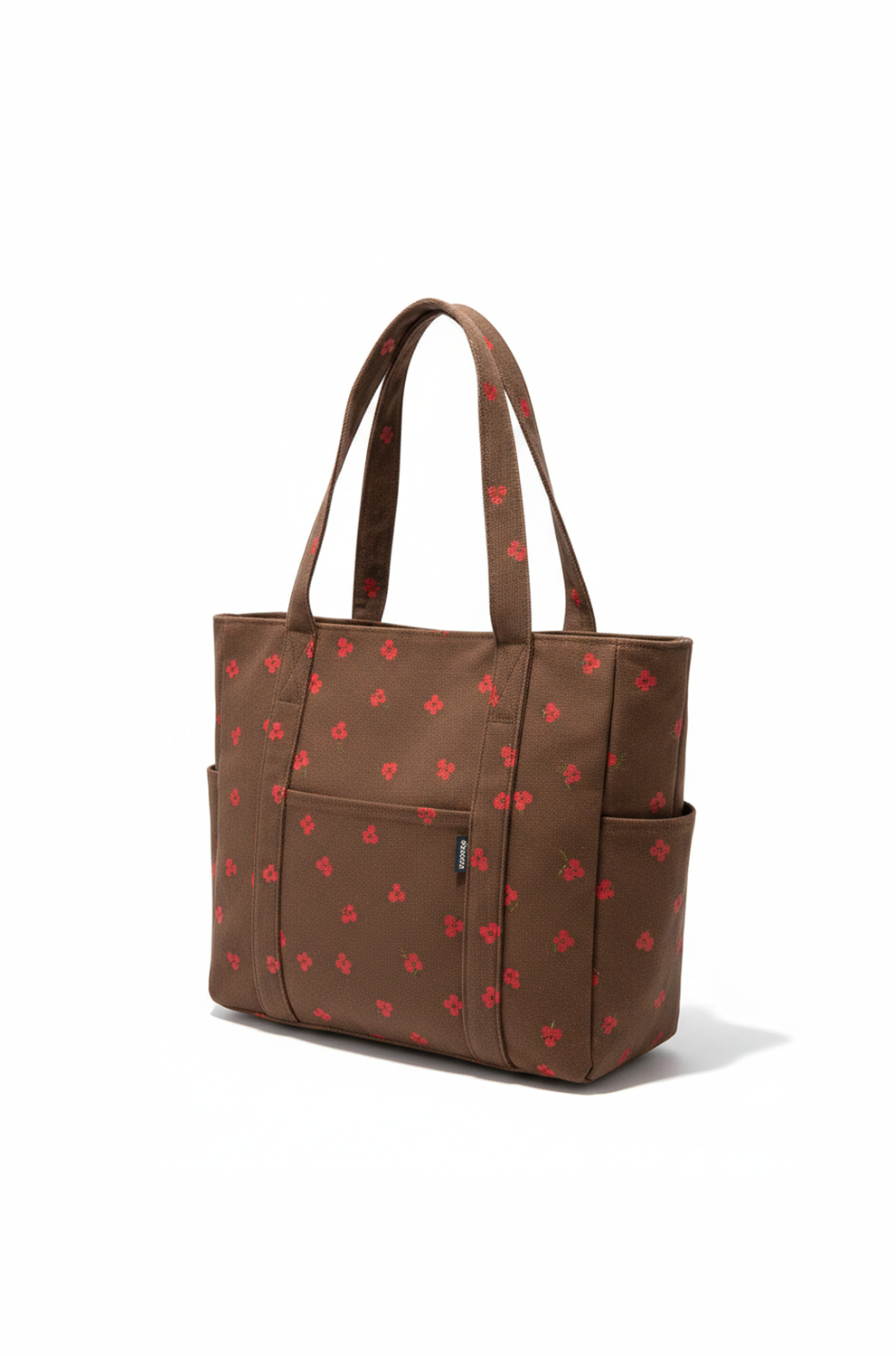 Brown tote bag with red heart pattern on a white background