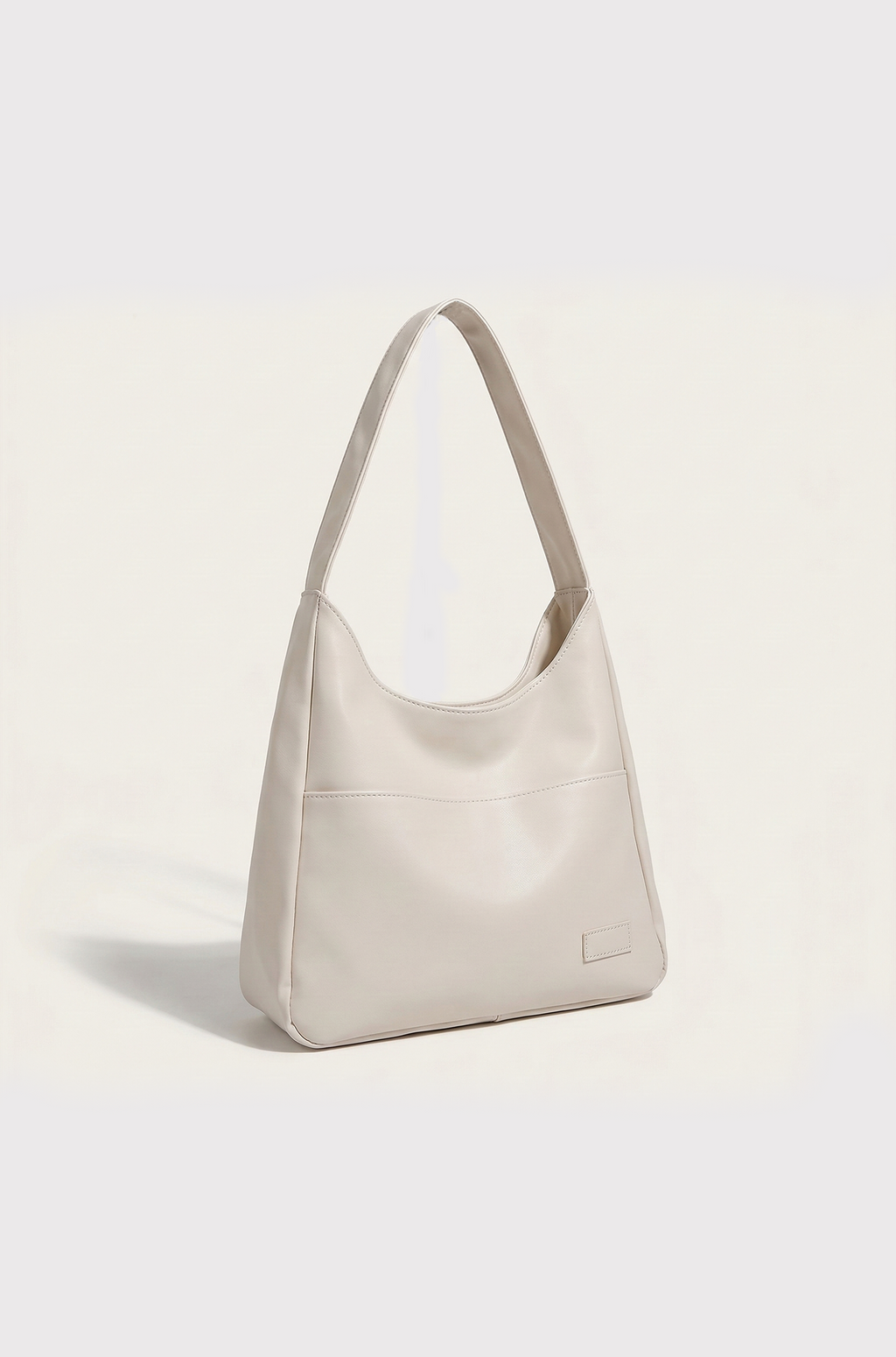 Beige shoulder bag on a light beige background