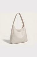 Beige shoulder bag on a light beige background
