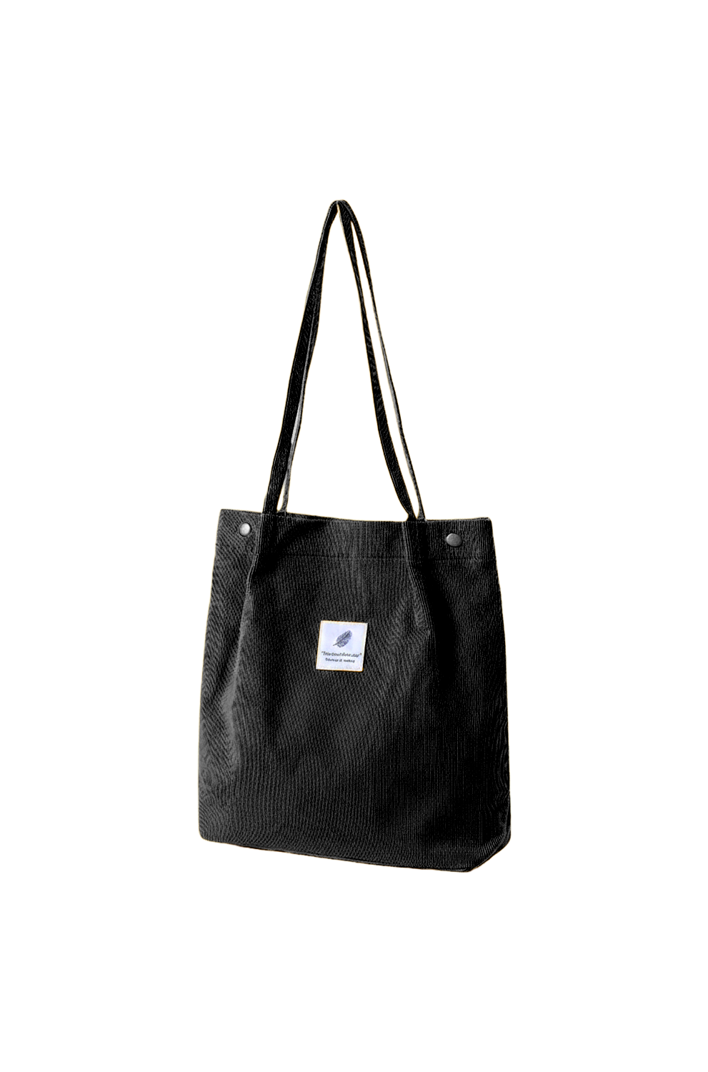Black tote bag with a small white label on a white background