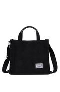 Black handbag with a strap on a white background