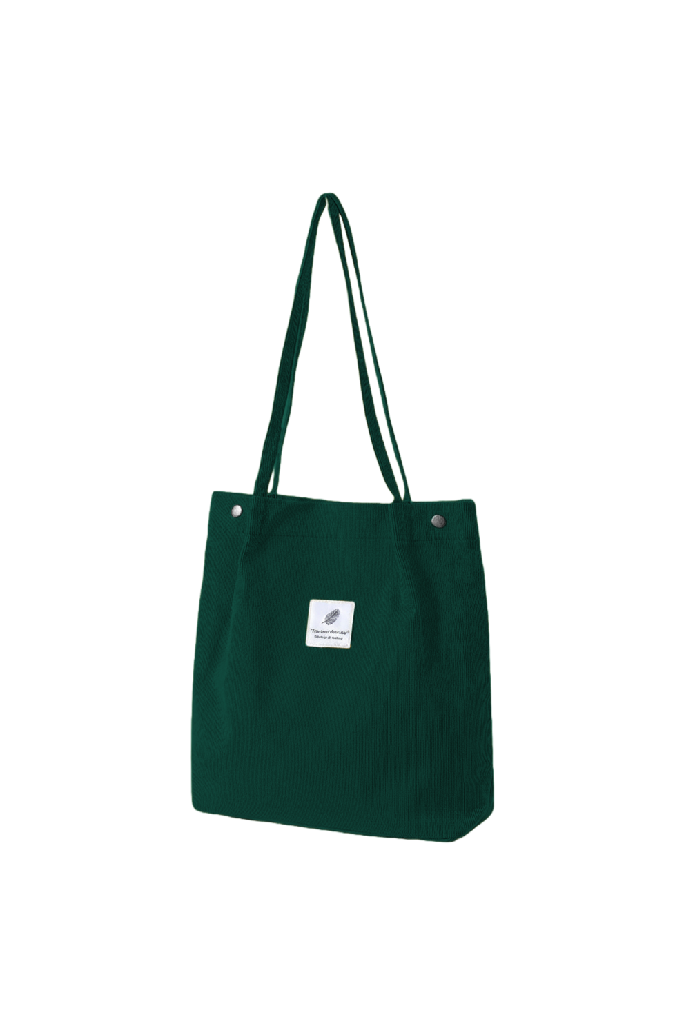 Green tote bag with a small white label on a white background
